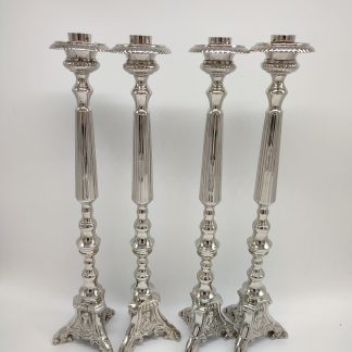Candelabros plateados sagrada familia