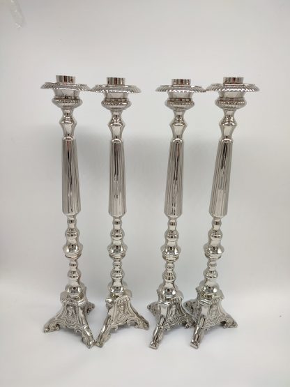 Candelabros plateados sagrada familia